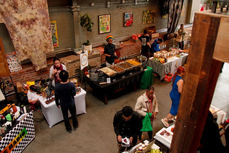 Overhead view of plant-based food service and vendor tables at a Mindful Matter Market