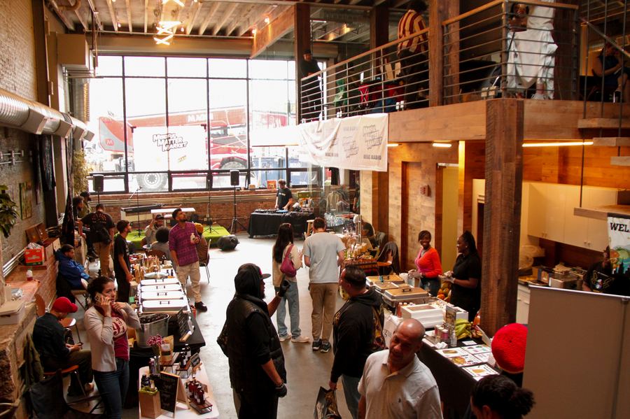 A live DJ set and vendor stalls at a Mindful Matter Market gathering in New York